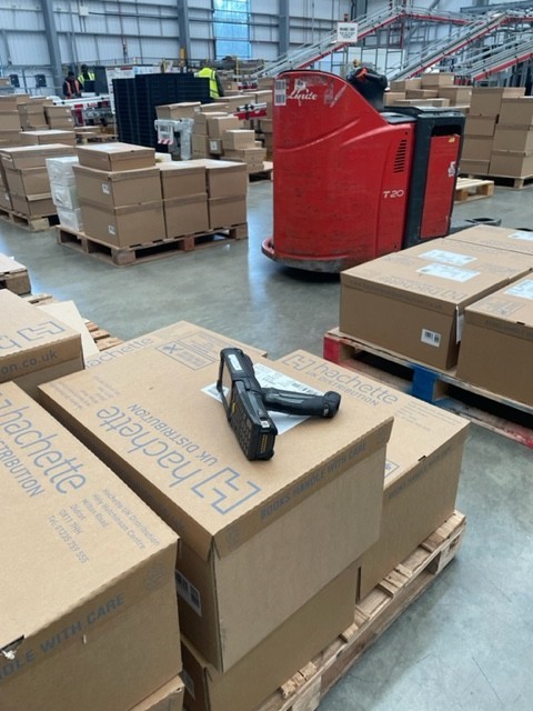 Stray mobile scanning device in a warehouse full of palleted goods